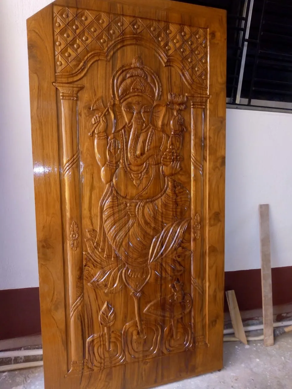 Tall Devotional Carved Wooden Door Design